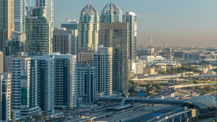 Dubai Marina skyscrapers aerial top view at sunrise from JLT in Dubai timelapse, UAE.