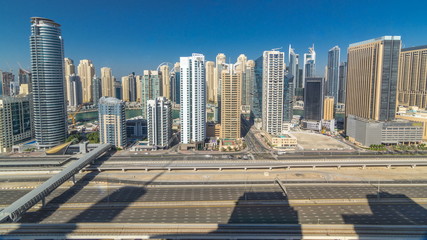 Naklejka na ściany i meble Dubai Marina skyscrapers aerial top view during all day from JLT in Dubai timelapse, UAE.