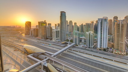 Fototapeta na wymiar Dubai Marina with colorful sunset in Dubai aerial timelapse, United Arab Emirates