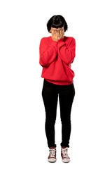 A full-length shot of a Short hair girl with red sweater with tired and sick expression over isolated white background