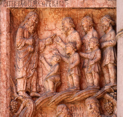 Christ Performing Works of Mercy relief at the baptistry from Benedetto Antelami, Parma, Emilia Romagna, Italy