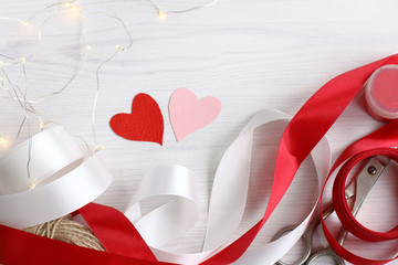 preparation for Valentine's Day. table with objects to create a holiday gift 