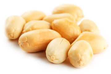 Peanuts isolated on white background. Peeled Peel and Scarlup.