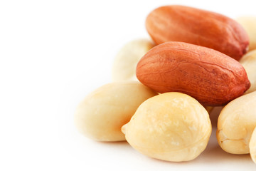 Peanuts isolated on white background. Peeled Peel and Scarlup.