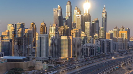 Fototapeta na wymiar Dubai Marina towers during sunset aerial timelapse, United Arab Emirates