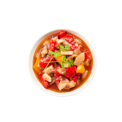 Colorful vegetable stew in a bowl in a bowl isolated on white background with clipping path
