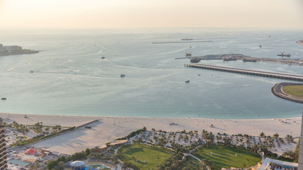 Fototapeta na wymiar Aerial view of modern skyscrapers and beach at Jumeirah Beach Residence JBR timelapse in Dubai, UAE