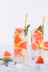 Cold fresh  homemade  lemonade with grapefruit ice, and rosemary herbs. Detox soda water recipe