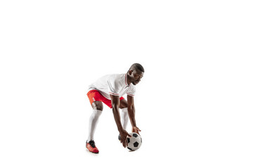 Plakat Professional african american football soccer player in motion isolated on white studio background. Fit jumping man in action, jump, movement at game.