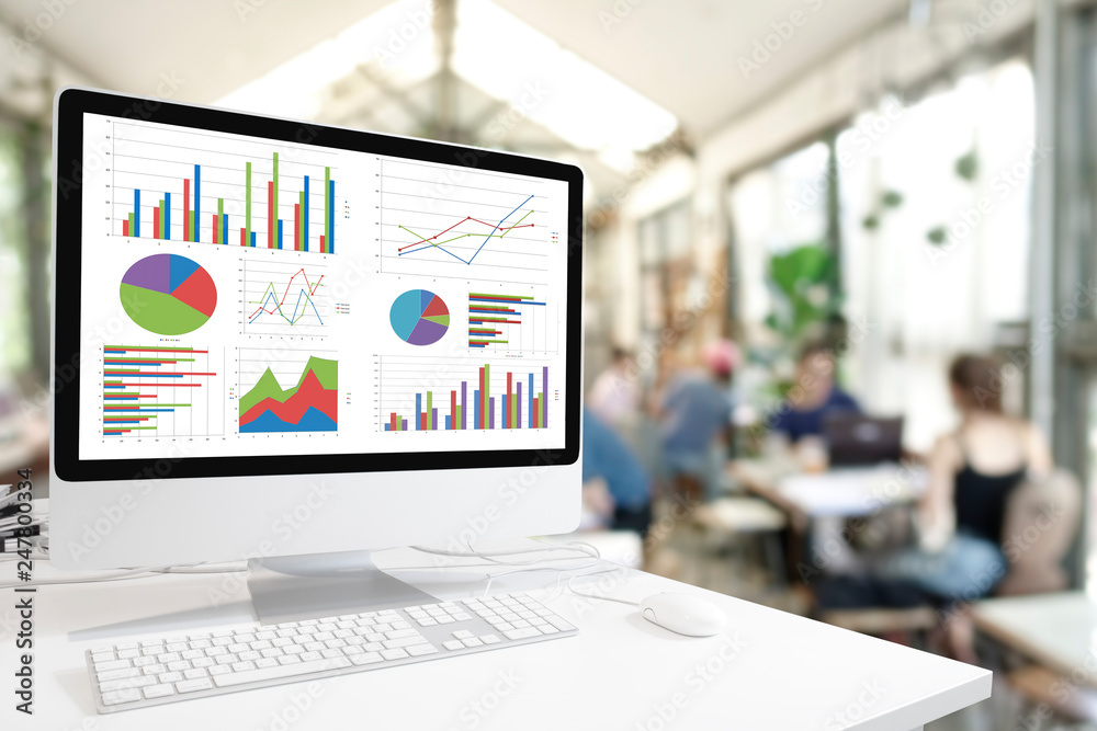 Poster Modern computer with keyboard and mouse on white table showing charts and graph on screen against lifestyle cafe coffee background , Analysis Business, Statistics Concept