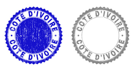 Grunge COTE D'IVOIRE stamps isolated on a white background. Rosette seals with grunge texture in blue and grey colors. Vector rubber stamp imitation of COTE D'IVOIRE title inside round rosette.