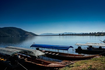 Mae Ngad Dam in chiang mai thailand mountains river and ship 