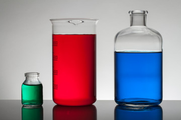 Liquid in laboratory bottles. Scientific biochemical laboratory. Colorful liquid.