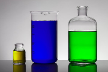 Liquid in laboratory bottles. Scientific biochemical laboratory. Colorful liquid.