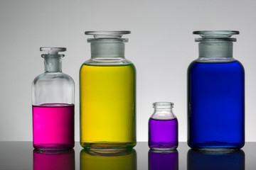Liquid in laboratory bottles. Scientific biochemical laboratory. Colorful liquid.