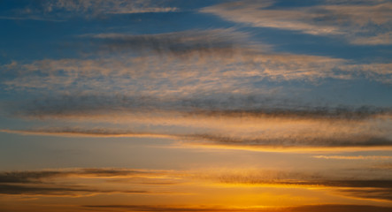 Fototapeta na wymiar Dramatic sunset sky with orange clouds.