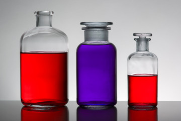 Liquid in laboratory bottles. Scientific biochemical laboratory. Colorful liquid.