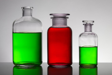 Liquid in laboratory bottles. Scientific biochemical laboratory. Colorful liquid.