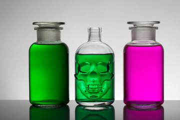 Liquid in laboratory bottles. Scientific biochemical laboratory. Colorful liquid.