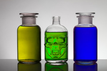 Liquid in laboratory bottles. Scientific biochemical laboratory. Colorful liquid.
