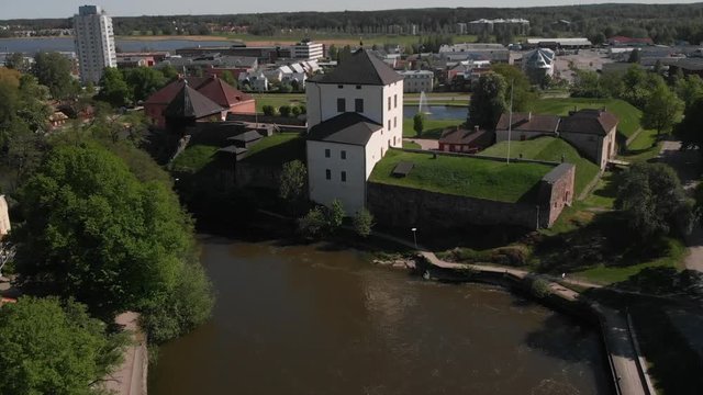 Flying towards the old castle (Nykopingshus) in Nykoping, Sweden. Aerial in slowmotion