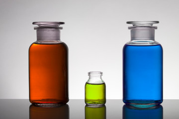 Liquid in laboratory bottles. Scientific biochemical laboratory. Colorful liquid.