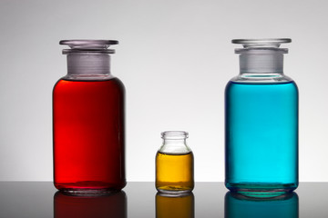 Liquid in laboratory bottles. Scientific biochemical laboratory. Colorful liquid.