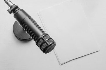 Professional microphone and empty paper