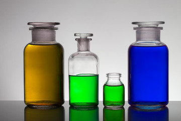 Liquid in laboratory bottles. Scientific biochemical laboratory. Colorful liquid.