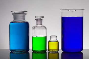 Liquid in laboratory bottles. Scientific biochemical laboratory. Colorful liquid.