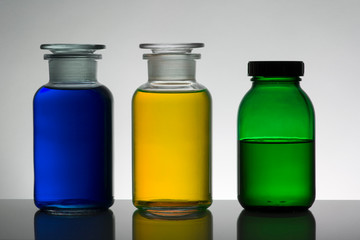 Liquid in laboratory bottles. Scientific biochemical laboratory. Colorful liquid.