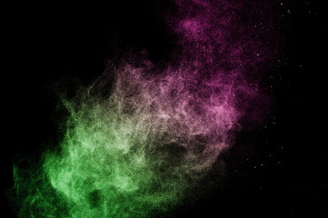 green and pink powder effect splash for makeup artist or graphic design in black background