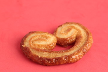 Puff pastry cookies on colorful background