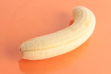 open banana on colorful background