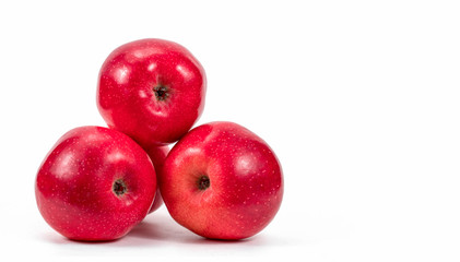 Red apples over white background