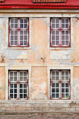 Original background. Fragment of an old building. Facade requiring repair