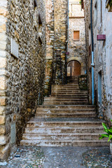 Fototapeta na wymiar Narrow street in medieval village of Besalu (Catalonia, Spain).