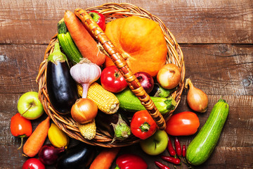 A basket with different vegetables and copy space for text .