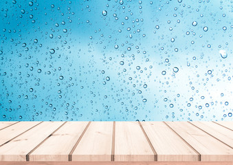 Wood plank with abstract water drop on glass background for product display 