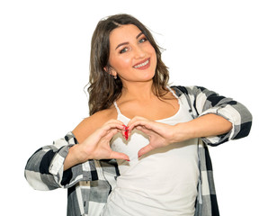 portrait of smiling happy young brunette woman making heart sign, symbol with hands. Isolated on...