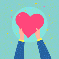 Charity concept. Hands are holding big heart symbol.