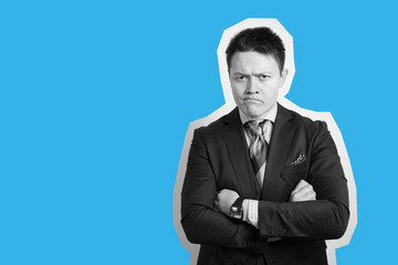 Young attractive guy businessman in suit on gray with skeptic expression nervously standing.