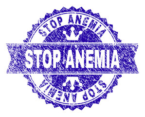 Obraz premium STOP ANEMIA rosette seal watermark with distress texture. Designed with round rosette, ribbon and small crowns. Blue vector rubber watermark of STOP ANEMIA text with scratched texture.