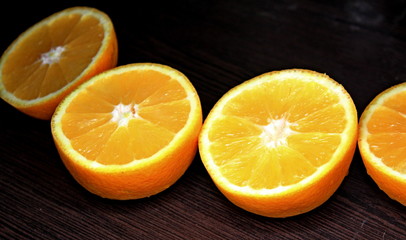 juicy orange in a cut on a dark background