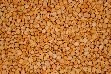Dry yellow split peas background texture