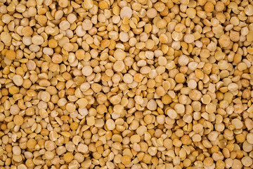 Dry yellow split peas background texture