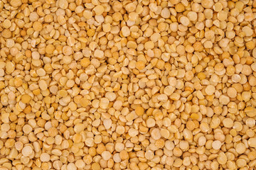Dry yellow split peas background texture