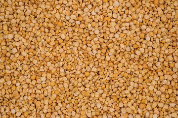 Dry yellow split peas background texture