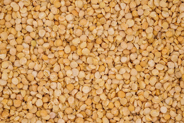 Dry yellow split peas background texture