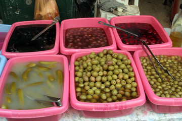 Sale of pickles in the souq of the Muslim Quarter in the Old City in Jerusalem, IL. Souqs are traditional middle eastern markets selling various foods and commodities.